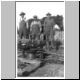 Ben Merchant, Percy Puffer, Clyde Hoopes pulling cedar trees on Percy's lower field in early 1920's.jpg